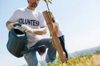 Man volunteering outside