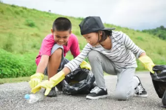 Children volunteering, picking up litter