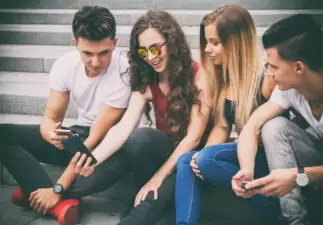 Group of friends looking at phone