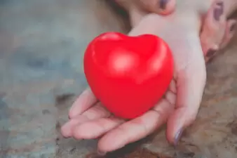 Woman hold red heart