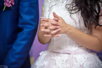 Bride crossing hands nervously