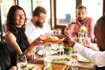 people happily eating at a restaurant