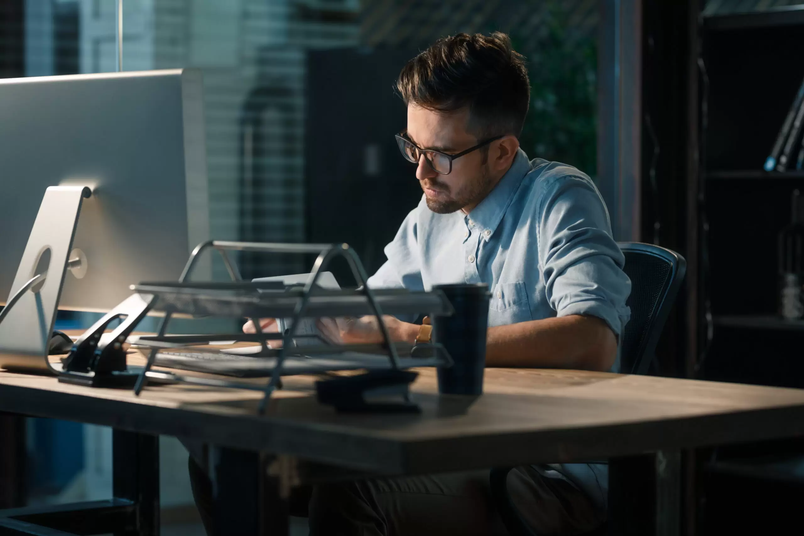 Concentrated man doing overdue work