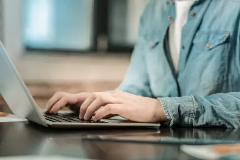 Close up of a nice smart man typing