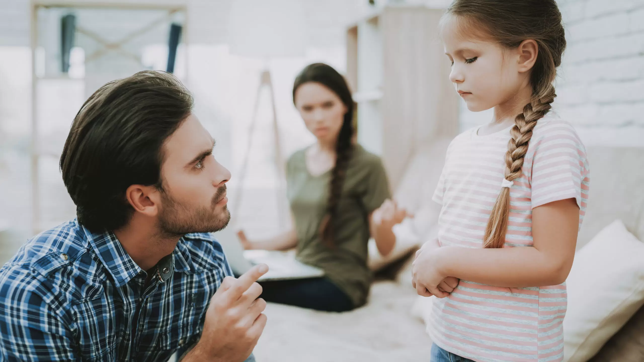 Father Scolds Daughter and Mom Working on Laptop.