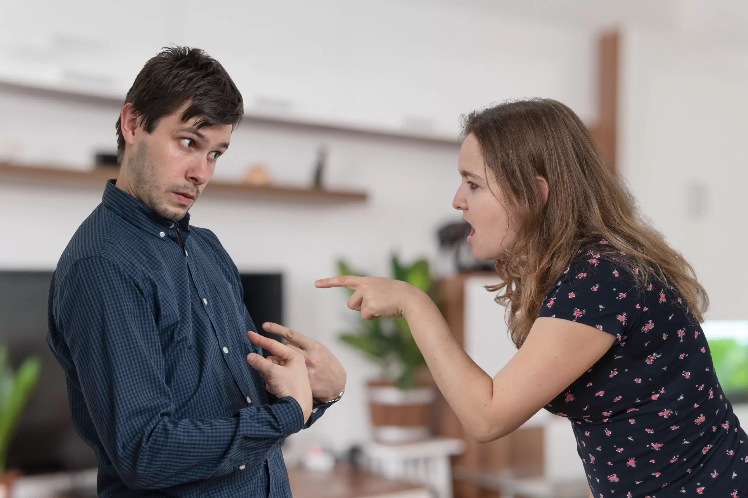 Jealousy hysterical woman is blaming and shouting on her husband