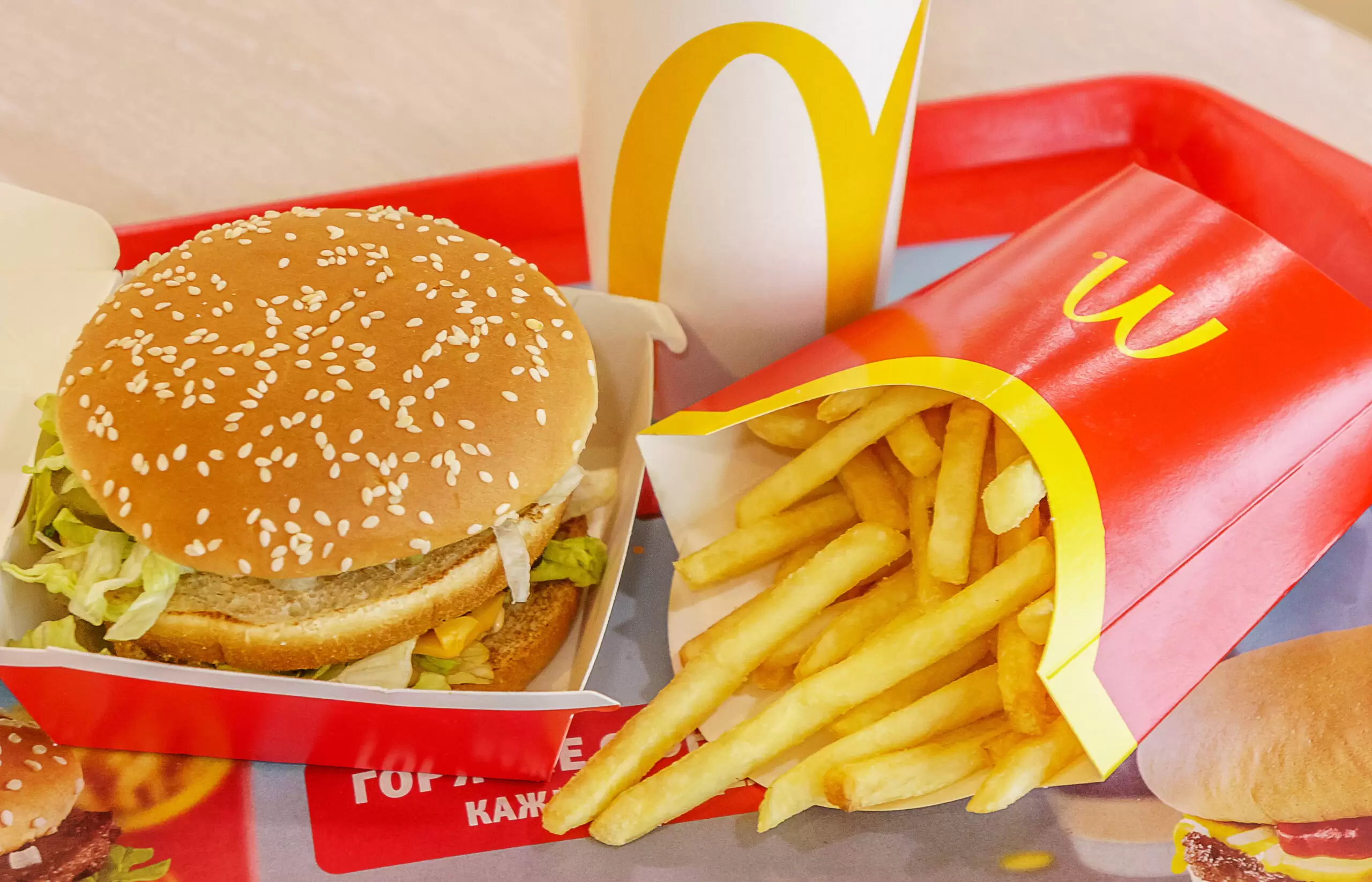 McDonald's burger, fries, and drink on tray