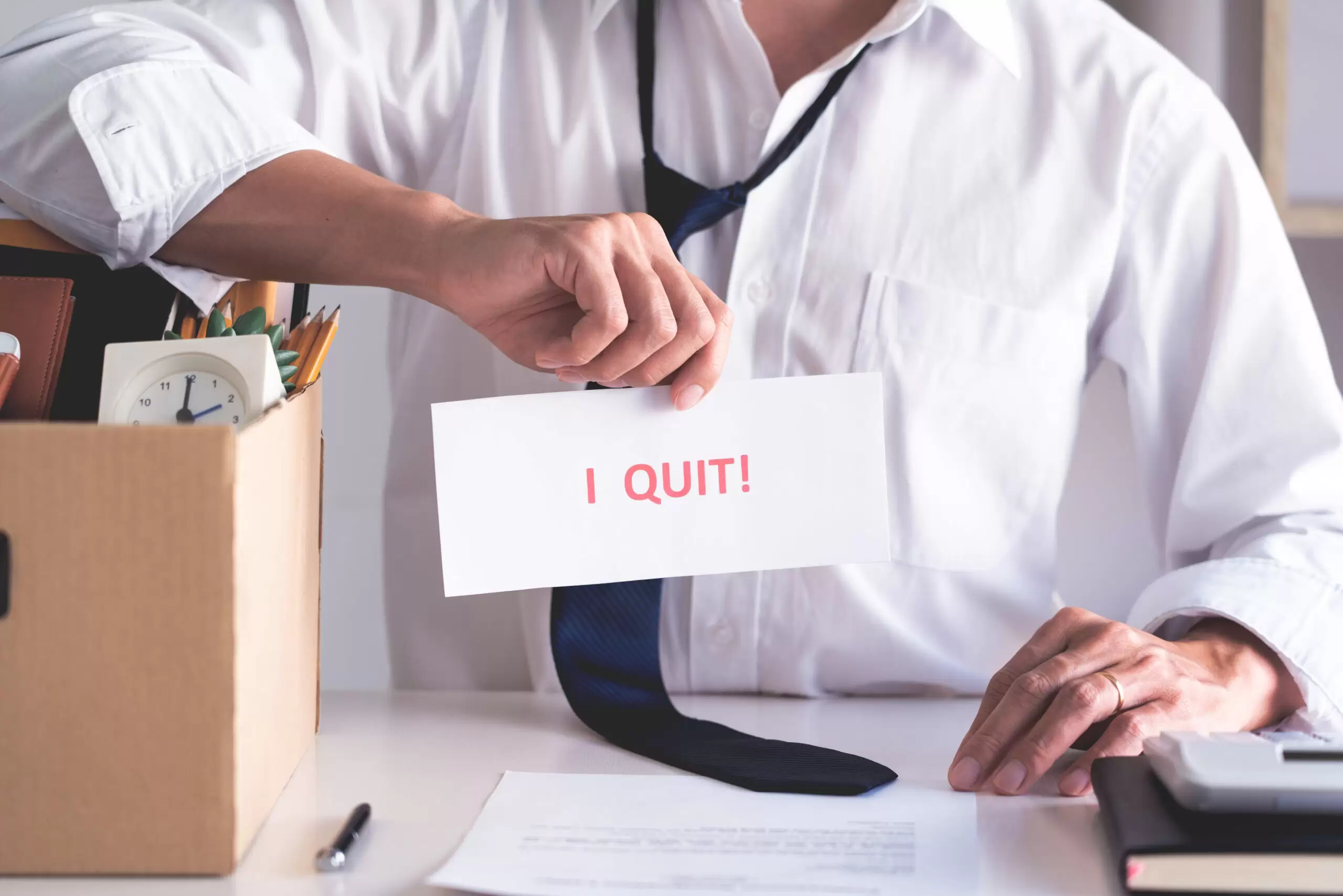 Businessman holding with I quit words card letter, resign employ