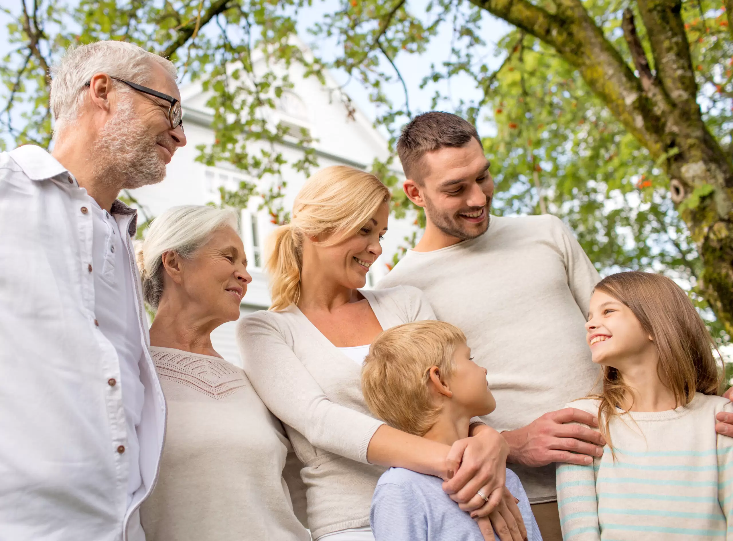 happy family in front of house outdoors