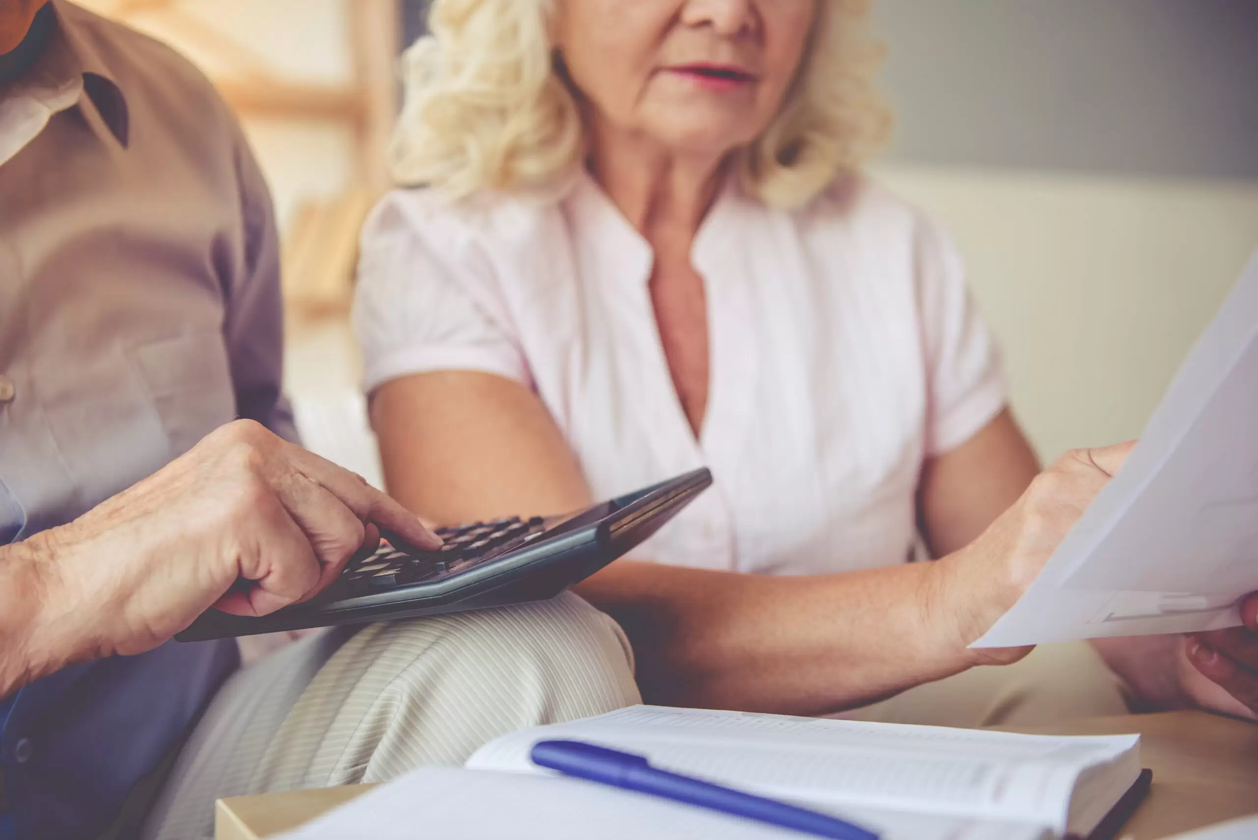 Older couple calculating a budget