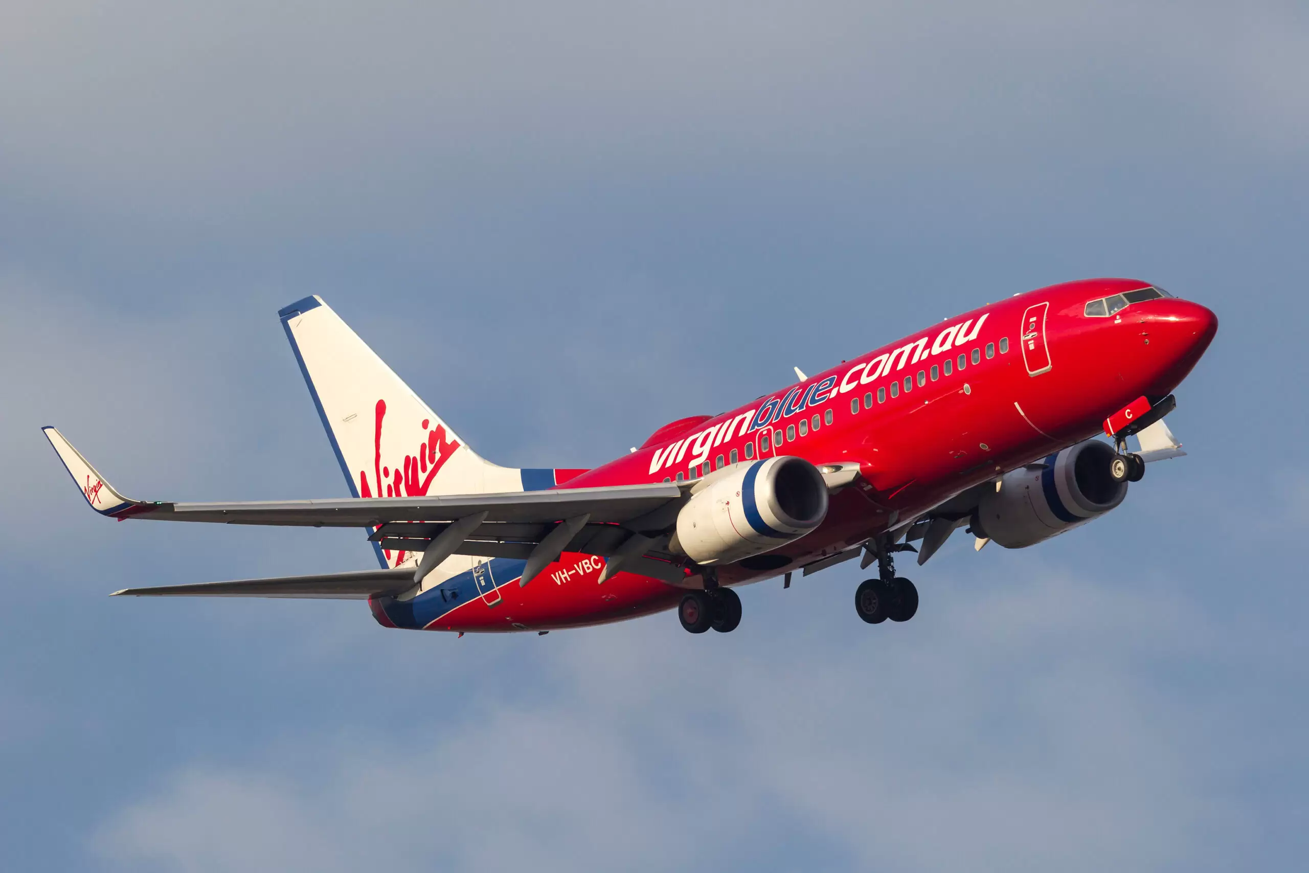 Melbourne, Australia - September 28, 2011: Virgin Blue Airlines Boeing 737-7Q8 VH-VBC turning on approach to land at Melbourne International Airport.